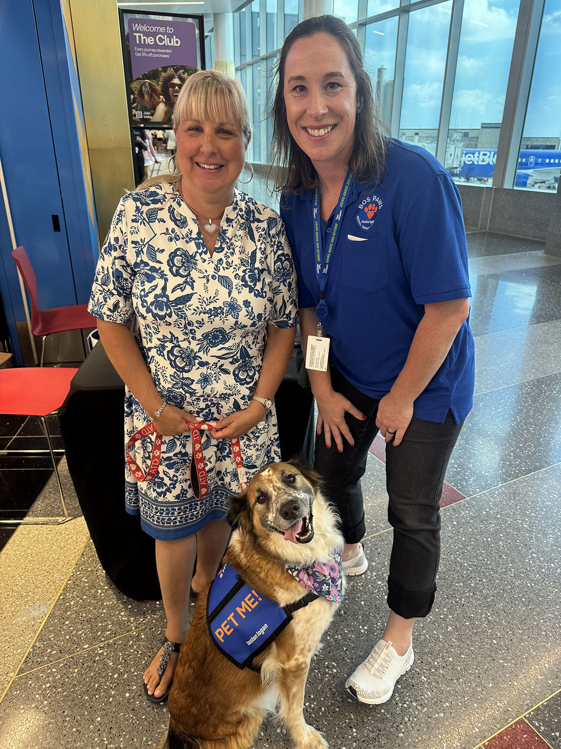 Christine Ricci-McNamee with Therapy Dog Riley and his handler.